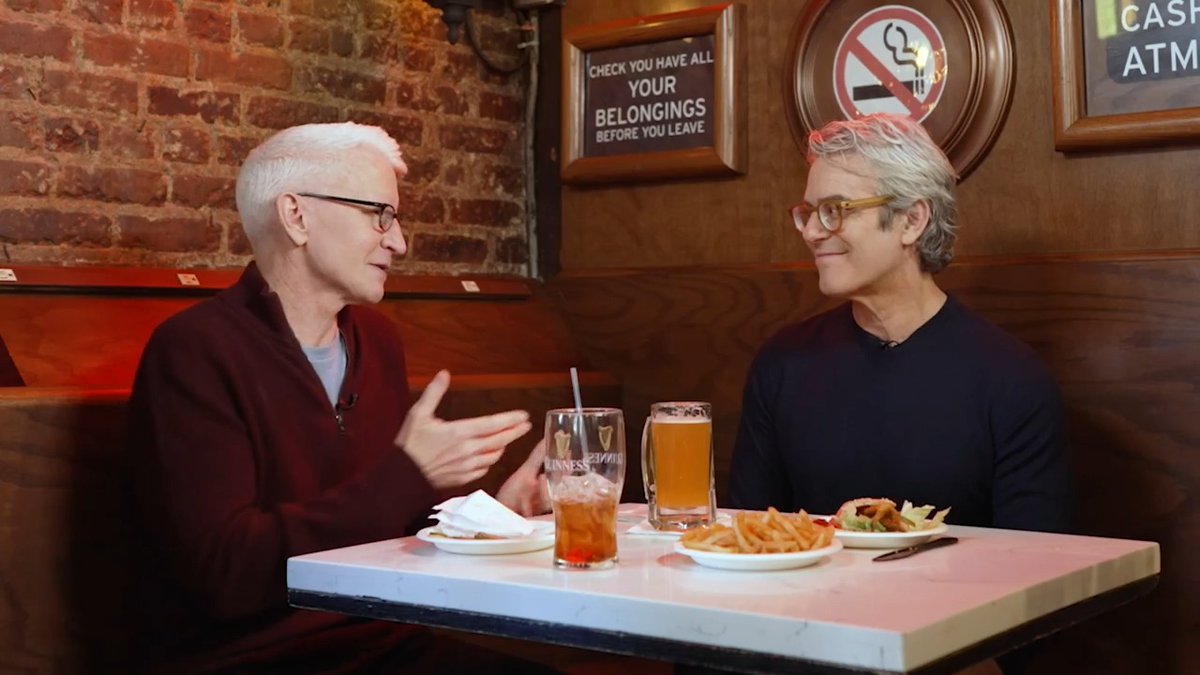 Anderson and Andy Cohen sit down at their favorite bistro and reflect on their most memorable New Year’s Eve moments. Watch the entire conversation at