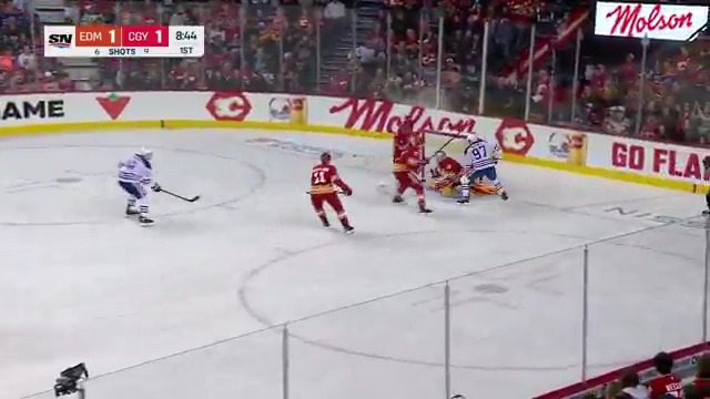 McDavid gets stuffed by Wolf on the breakaway then ROCKED by Kevin Bahl