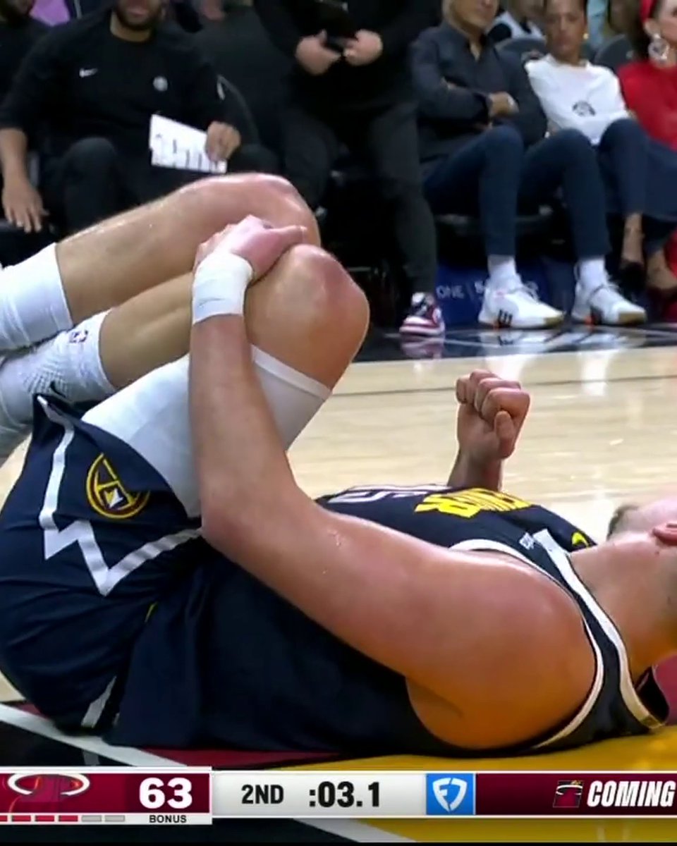 Nikola Jokic went down with an apparent leg injury vs. the Heat.
