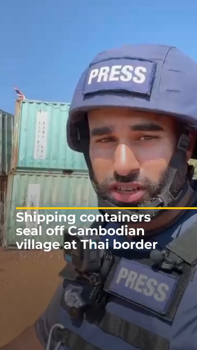 Behind the Thai containers and barbed wire is the Cambodian village of Chok Chey, a disputed area now blocked by Thai forces, leaving residents unable to access their homes and some reporting warning shots when they tried to approach. Cambodia maintains that borders here are defined by existing treaties and international law, while Thailand does not recognize the area as Cambodian, a dispute that continues to leave civilians caught in the middle and cut off from their village.