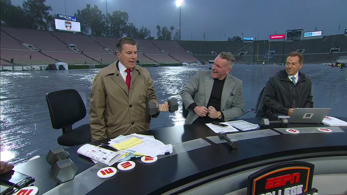The College GameDay crew trying to guess the weight of these dumbbells 💪 😅