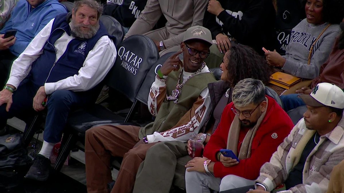 Jazz and his fiancé are sitting courtside at the Nets game tonight