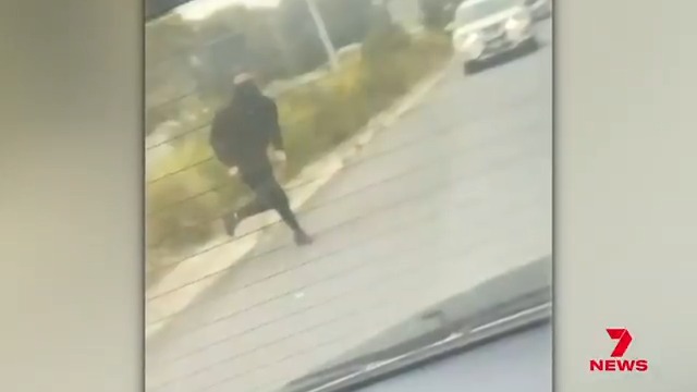 Innocent Melbourne drivers have been caught up in machete madness on the Monash Freeway. Panicked motorists made a beeline for the exit ramp, when masked thugs ran from a crash, carrying out a rampage through busy traffic.