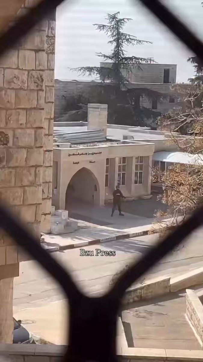 Footage shows a soldier opening fire with live bullets toward students as occupation forces storm Birzeit University campus today.