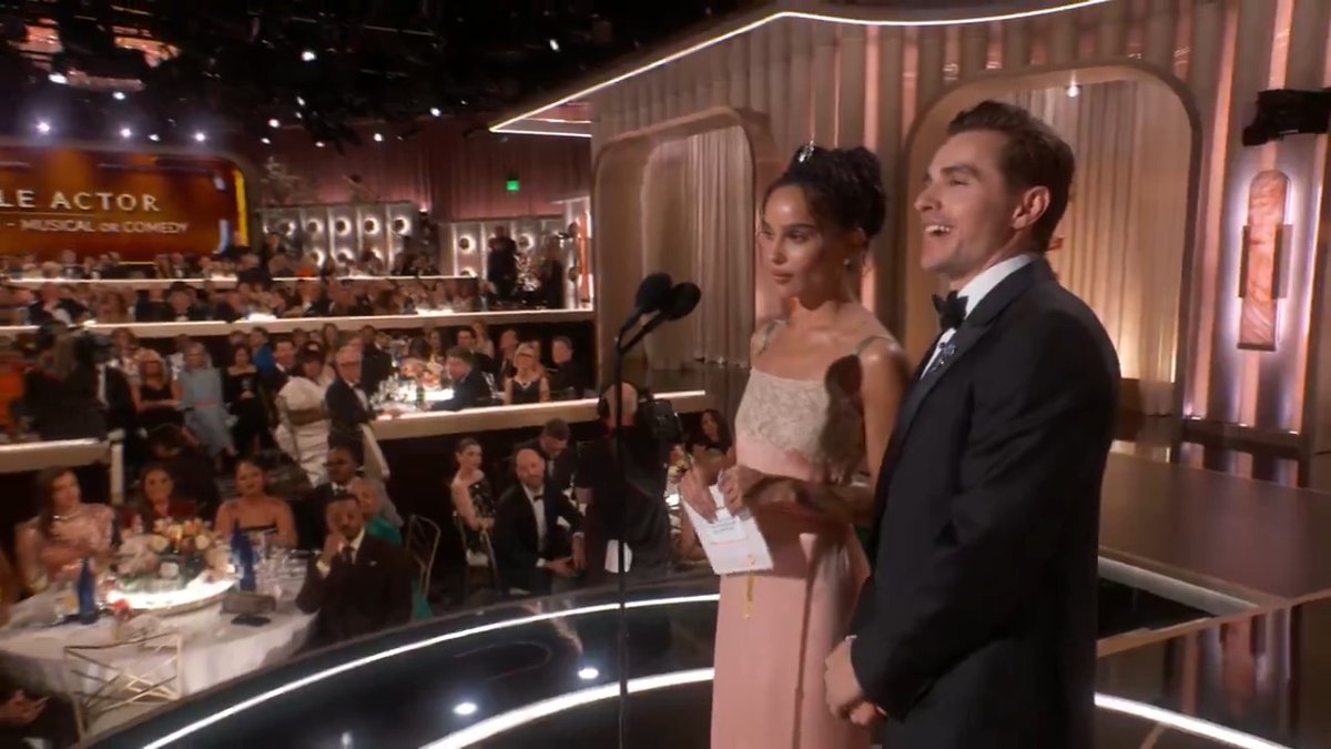Dave Franco and Zoë Kravitz hand off the 🏆 to tonight's winner for Best Male Actor – Television – Musical/Comedy. #GoldenGlobes