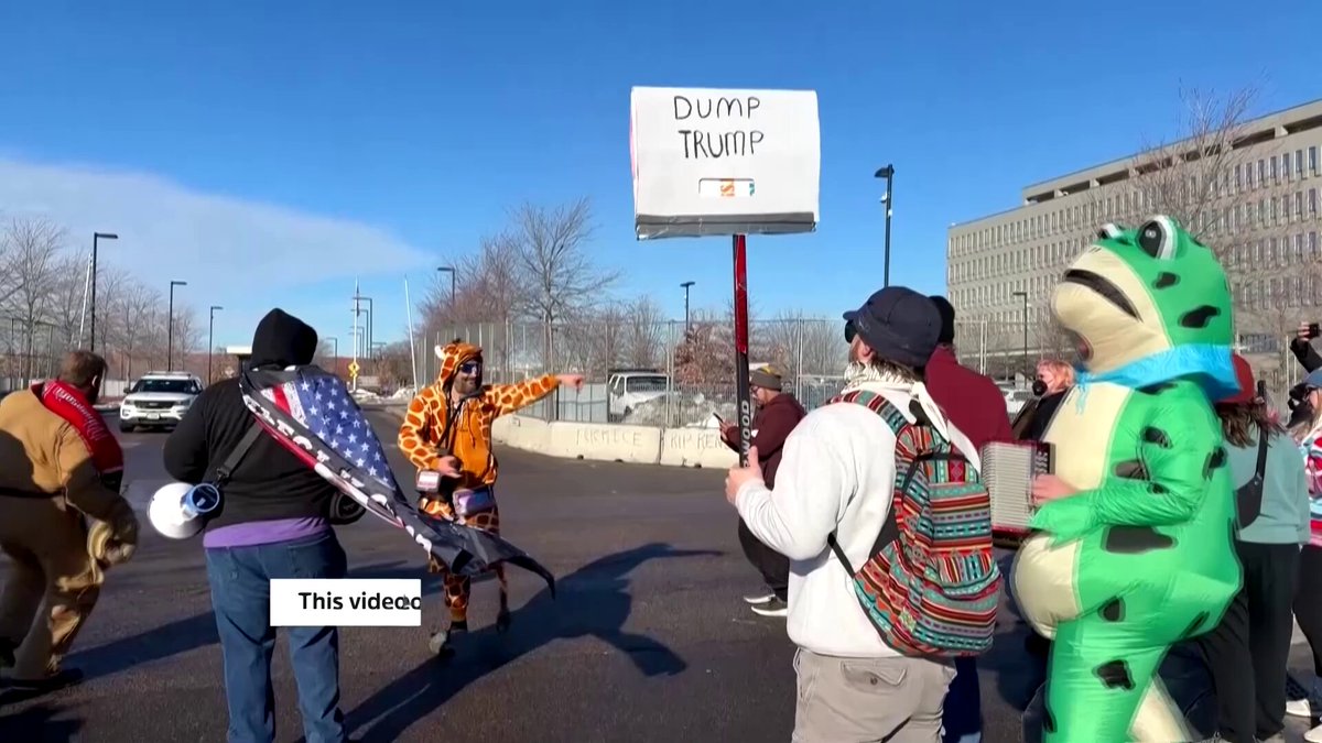WARNING: STRONG LANGUAGE US Immigration and Customs Enforcement agents arrested a comedian and protest singer known as Robby Roadsteamer, who was wearing a giraffe costume, during a protest outside a federal building in Minneapolis