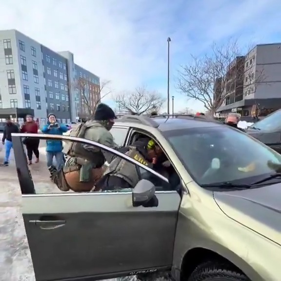 New video shows ICE agents detaining a US citizen legal observer in Minneapolis. The agents smashed his car window, dragged him out, and placed a knee on his neck.