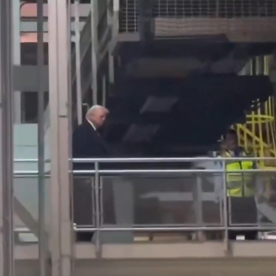 Trump is seen flipping off Ford worker who appears to yell "pedophile protector" as he walks by