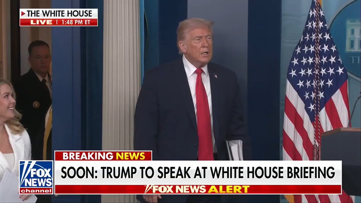 TRUMP makes a big entrance to the White House press briefing with a large stack of paper: "These are accomplishments."