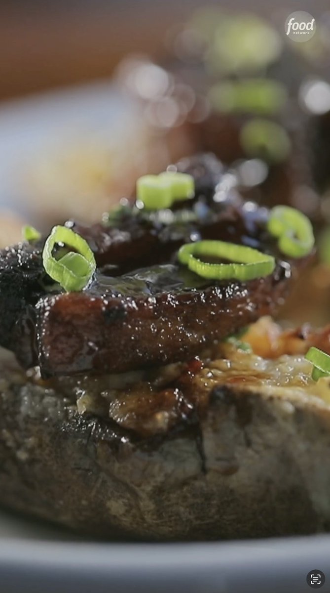 Not your average baked potato! Cheesy, twice-baked and topped with crispy pork belly, Eric Greenspan did not hold back 🤤🥔 Get the recipe: