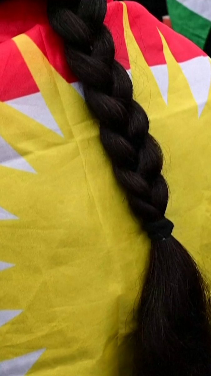 Following a viral video showing a Syrian soldier holding the braid of a slain Kurdish woman fighter, Iraqi Kurdish women braided their hair in solidarity with Syrian Kurds at a protest in Erbil. Online, Kurdish women around the world are also posting pictures of their braids: