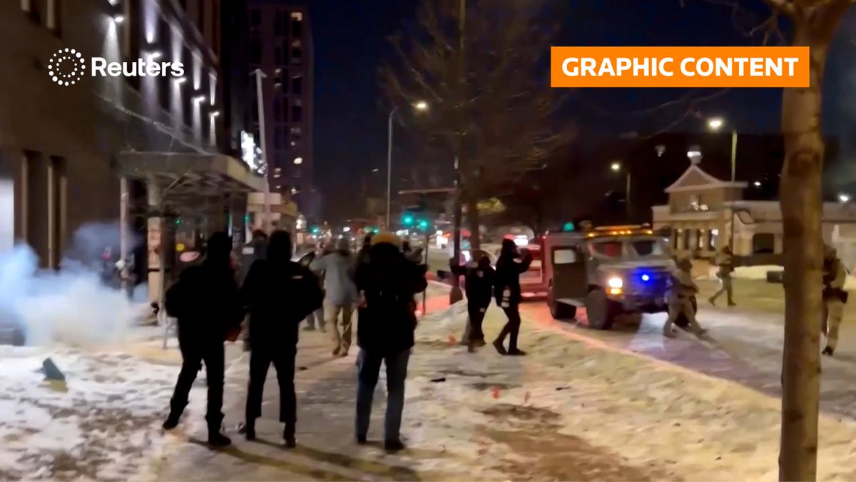 WARNING: GRAPHIC CONTENT US security forces threw smoke bombs at protesters in Minneapolis as unrest continues against an ICE enforcement surge in the city