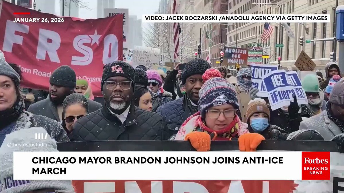 Chicago Mayor Brandon Johnson joins protests demanding ICE abolition—with Freedom Road Socialist Organization banners proudly displayed behind him.