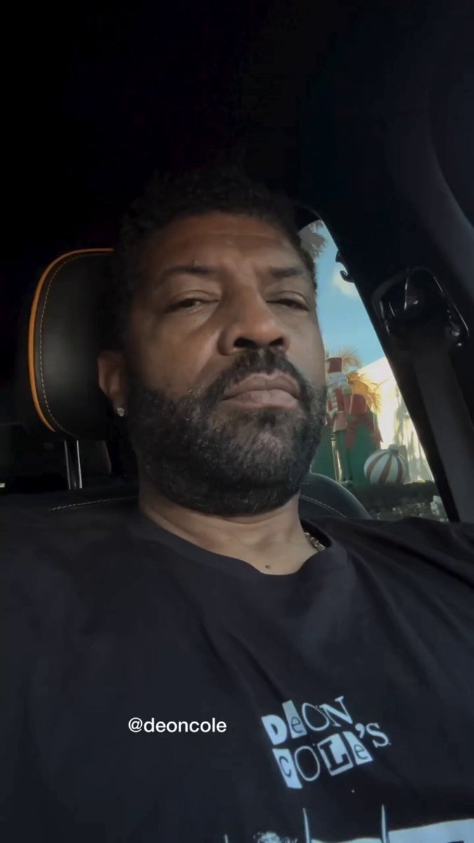 Comedian Deon Cole posts a video while sitting inside his Rolls-Royce reacting to random people taking pictures of his Rolls-Royce, not realizing he’s inside the car the entire time because his car windows are tinted. (🎥 Funny Knowing You/YouTube)