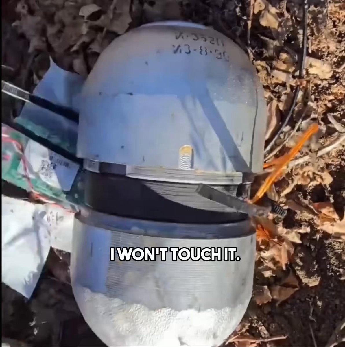 A Ukrainian improvised landmine dropped by a drone uses the two separated halves of an AO-2.5RTM fragmentation submunition. A printed adapter filled with C4 explosive rejoins the two parts, with a “Jonik” electronic magnetic-influence fuze replacing the original fuze. 1/