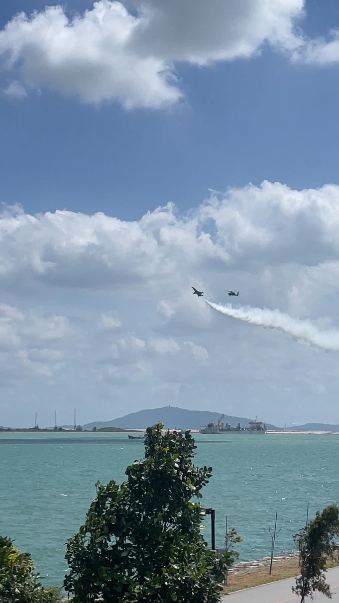 A Lockheed Martin F-16C joins a Boeing AH-64 Apache Longbow from the Republic of Singapore Air Force Aerial Display Team as the 2026 Singapore Airshow flying display gets underway.