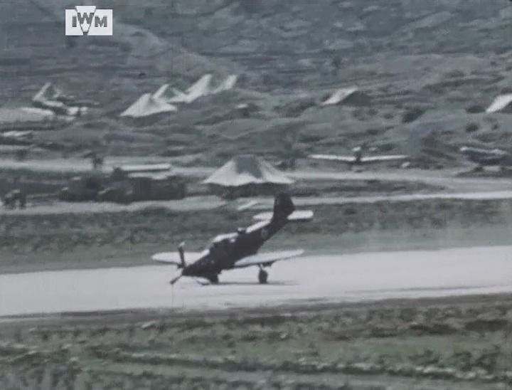 An Italian Airacobra makes an emergency landing at Vis Aerodrome in Croatia, 1945. Film: IWM AAY 242 <1/2>