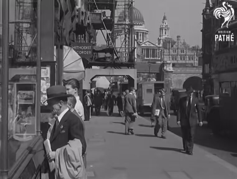 A beautiful film capturing the everyday rhythm of London life. Shoppers move along busy pavements as buses glide through the streets in this quiet, evocative window into 1950s England.