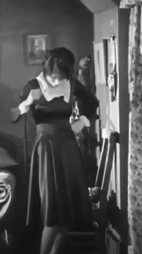 Clara Bow cutting her day dress into a sexier evening gown in the 1927 silent film "It" in which her vivacious personality and beauty gave her the nickname "The It Girl"