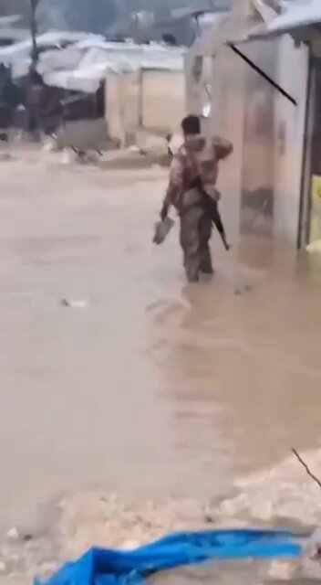 One of the Syrian army soldiers, after finishing his duty shift, returned to his tent amid rain and flooding, only to find it completely flooded in Kharbat al-Jouz, west of Idlib. These fighters, who toppled the Assad regime are sons of refugee camps in Idlib and still live in tents.