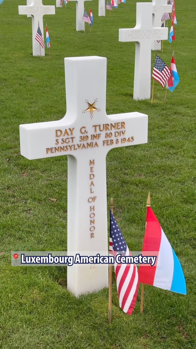 Today we remember WWII Medal of Honor recipient Staff Sgt. Day G. Turner, buried at Luxembourg American Cemetery. 🇺🇸🇱🇺 His Medal of Honor citation reads: "Turner commanded a nine-man squad with the mission of holding a critical flank position. When overwhelming numbers of the enemy attacked under cover of withering artillery, mortar, and rocket fire, he withdrew his squad into a nearby house, determined to defend it to the last man. The enemy attacked again and again and were repulsed with heavy losses. Supported by direct tank fire, they finally gained entrance, but the intrepid sergeant refused to surrender although five of his men were wounded and one was killed. He boldly flung a can of flaming oil at the first wave of attackers, dispersing them, and fought doggedly from room to room, closing with the enemy in fierce hand-to-hand encounters. He hurled hand grenade for hand grenade, bayoneted two fanatical Germans who rushed a doorway he was defending, and fought on with the enemy's weapons when his own ammunition was expended. The savage fight raged for four hours, and finally, when only three men of the defending squad were left unwounded, the enemy surrendered. Twenty-five prisoners were taken, 11 enemy dead and a great number of wounded were counted. Turner's valiant stand will live on as a constant inspiration to his comrades. His heroic, inspiring leadership, his determination, and courageous devotion to duty exemplify the highest traditions of the military service." We remember his service and sacrifice.