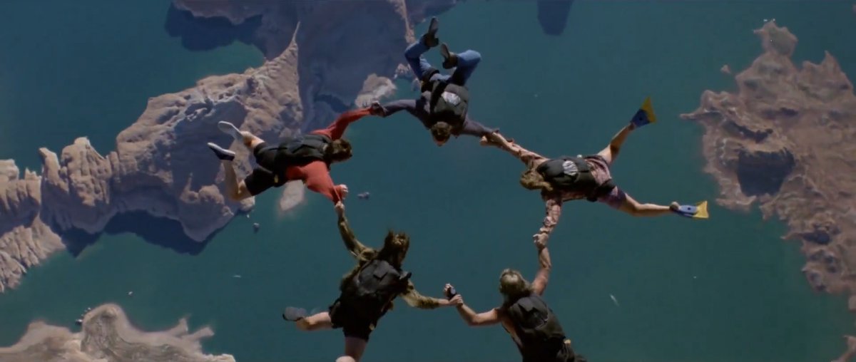 Point Break (1991) is just a flat-out great action movie. Surf chases, skydiving, bank robberies, foot pursuits, all shot with real physicality and nerve. Big, reckless set pieces anchored by pure adrenaline and attitude.