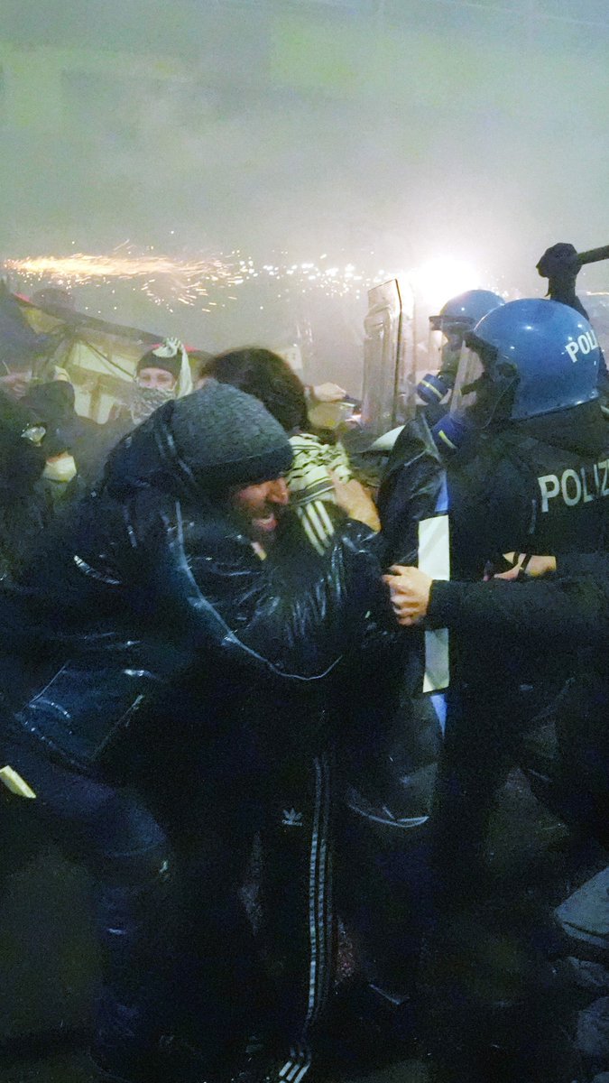 Protesters clashed with police at the Milan Winter Olympics, with some launching fireworks and smoke bombs. Police used tear gas and a water cannon to disperse the crowds. They broke off from a larger peaceful march over spending, environmental concerns, and US ICE agents.