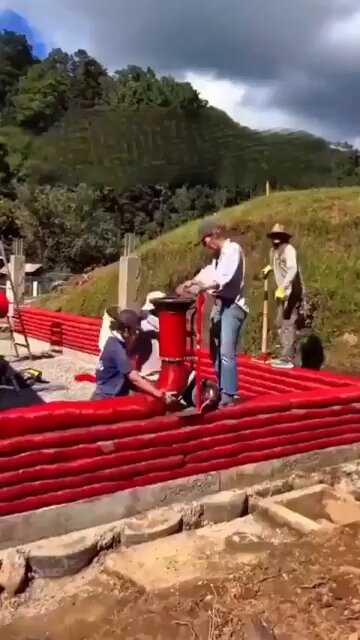 Earth-filled fabric construction turns local soil into serious structural strength. Layered, compacted earth inside continuous fabric tubes creates load-bearing, cost-efficient, climate-responsive walls. [📹 nonwellscityprojectsltd]