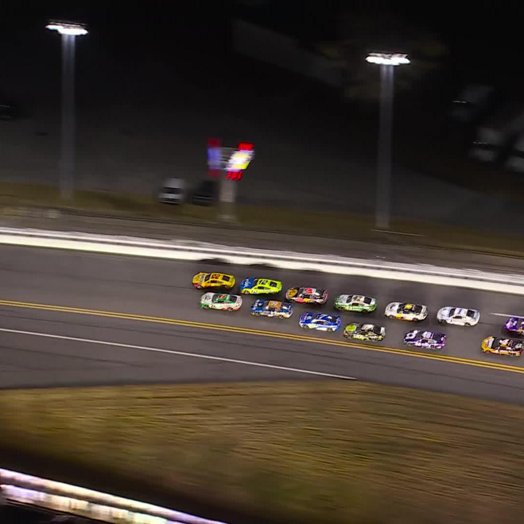 .Joey Logano wins Duel 1 and multiple cars get tangled at the rear of the pack.