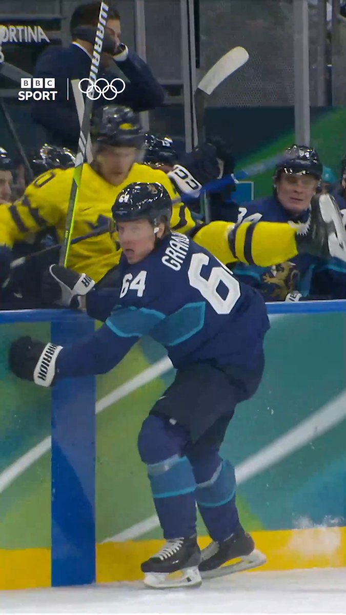 "You can't sit there, mate!" A big hit sees Sweden's Elias Pettersson over the barriers and into the Finland bench 😱🏒