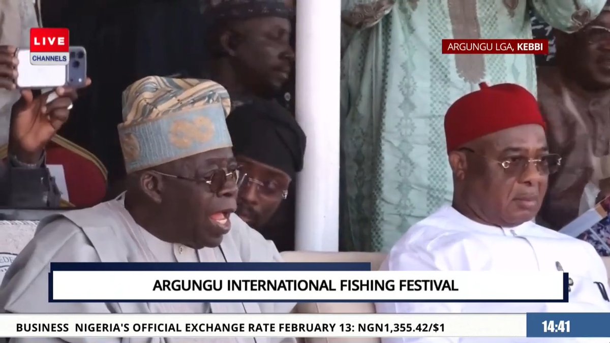 Tinubu wowed, looks on as the biggest catches of the Argungu Festival are brought to the scales. #CTVTweets #ArgunguFestival