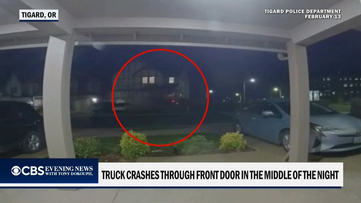 Police say a pickup truck slammed into a home near Portland, Oregon, after striking a dirt mound and soaring roughly 100 feet through the air. No injuries were reported, and the driver is facing a reckless driving charge.