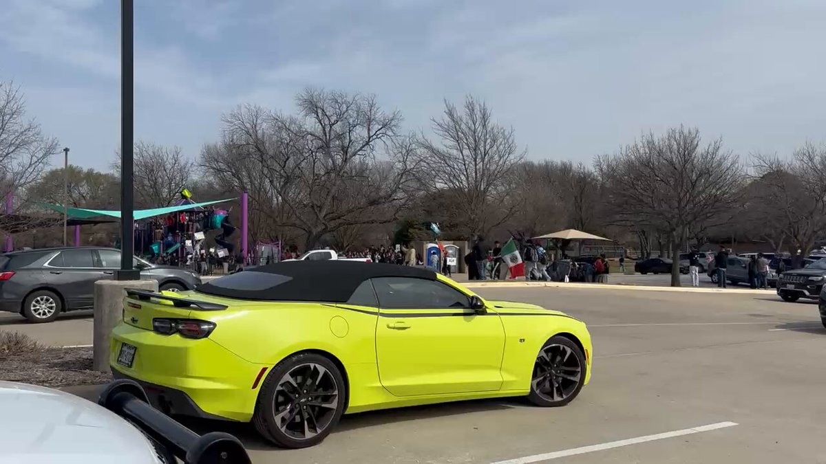 🚨EULESS, TEXAS🚨Euless Texas Voting Center is being harrassed by a LARGE Anti-Ice Group. They are waving Mexican flags and are from a nearby High School. Why are schools allowing this?? And why are they right next to a polling site???! INVESTIGATE! Follow: Carlos Turcios