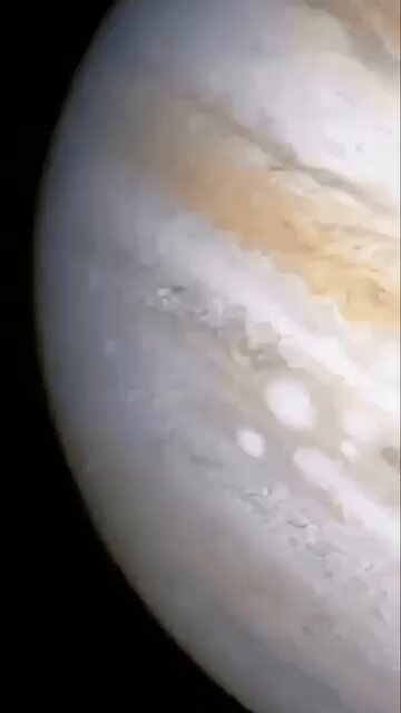 In July 1994, NASA's Hubble Space Telescope captured one of the most dramatic events ever witnessed in our solar system: the spectacular collision of Comet Shoemaker-Levy 9 with Jupiter—the first-ever directly observed impact between two solar system bodies.Discovered just a year earlier, the comet had already been torn into a dramatic "string of pearls" of roughly 21 fragments by Jupiter's powerful tidal forces during a close pass in 1992. Those pieces then slammed into the giant planet at staggering speeds of about 60 km/s (over 130,000 mph) between July 16 and 22, 1994.The crashes unleashed enormous fireballs and ejected massive plumes of material high above the cloud tops, excavating debris from Jupiter's deeper atmospheric layers. Hubble's razor-sharp images revealed huge, dark scars—some stretching more than Earth's diameter across—etched into the planet's southern hemisphere. These eerie black blemishes, composed of impact debris and altered chemistry, lingered for months and were so prominent they could be spotted even through modest backyard telescopes. The towering plumes provided astronomers an unprecedented window into Jupiter's hidden chemistry, revealing sulfur compounds and other materials dredged up from below the visible clouds. This once-in-a-lifetime spectacle revolutionized our knowledge of cosmic collisions, dramatically underscored Jupiter's vital role as the solar system's gravitational "sweeper" that deflects or captures many potential Earth-threatening objects, and fueled major advances in planetary defense strategies. Source: NASA Goddard Space Flight Center (with imagery from Hubble observations)