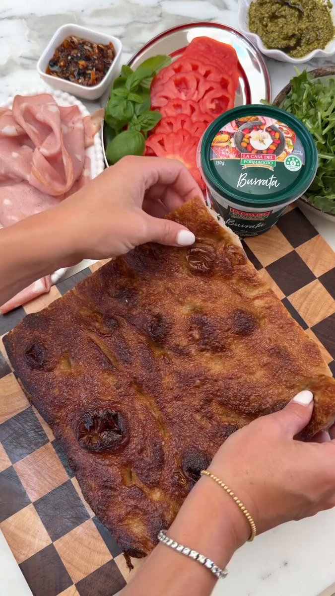 Focaccia with creamy and soft burrata drizzled with a chilli crisp. 🎥 recipesbyvictoria | IG