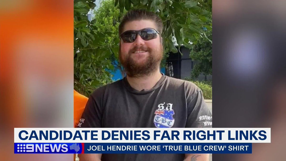 A One Nation candidate has been forced to deny links to a far right extremist group despite photos emerging of him wearing their merchandise. #9News Gus Macdonald