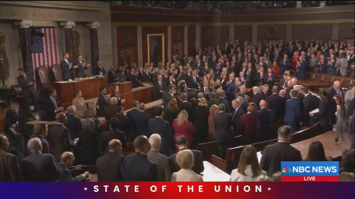 Rep. Al Green holds up a sign reading "BLACK PEOPLE AREN'T APES" as Trump arrives at the State of the Union. Trump recently posted a racist video depicting the Obamas as apes.