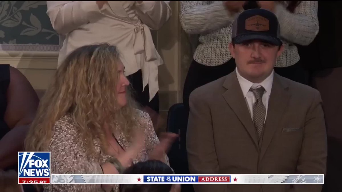 PRESIDENT TRUMP presents Andrew Wolfe, the National Guardsman who was shot in Washington, D.C. by an illegal alien, with the Purple Heart during his State of the Union address.