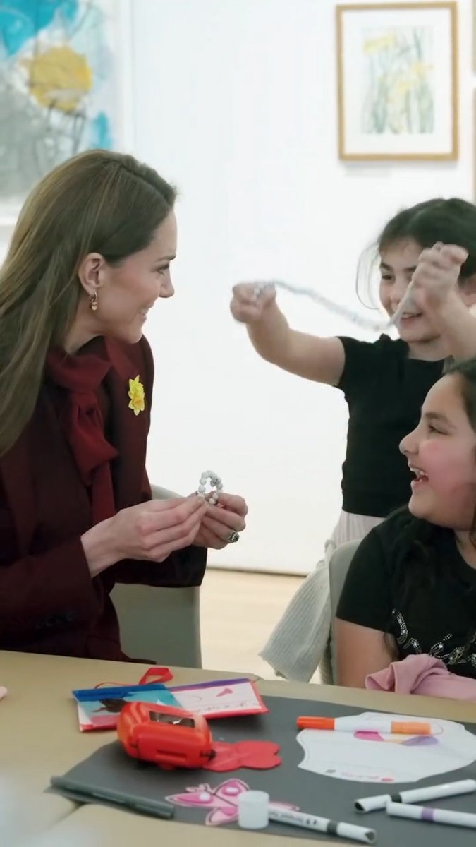 Princess Kate was given the sweetest beaded necklace made for her by a lovely young girl in Wales 💖 The pair were making crafts together at the 'Oriel Davies Gallery' when the girl unclasped the necklace from her neck and put it on the Princess, both smiling wide and making each other's days ✨ 📽️ : #PrinceandPrincessofWales