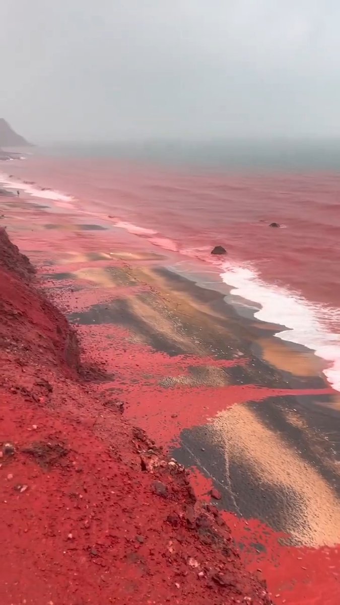Iran’s Hormuz Island Heavy rain turns Red Beach crimson as iron oxide soil washes into the Persian Gulf.