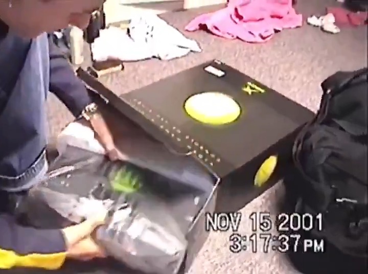 A family unboxing their brand new XBOX in 2001