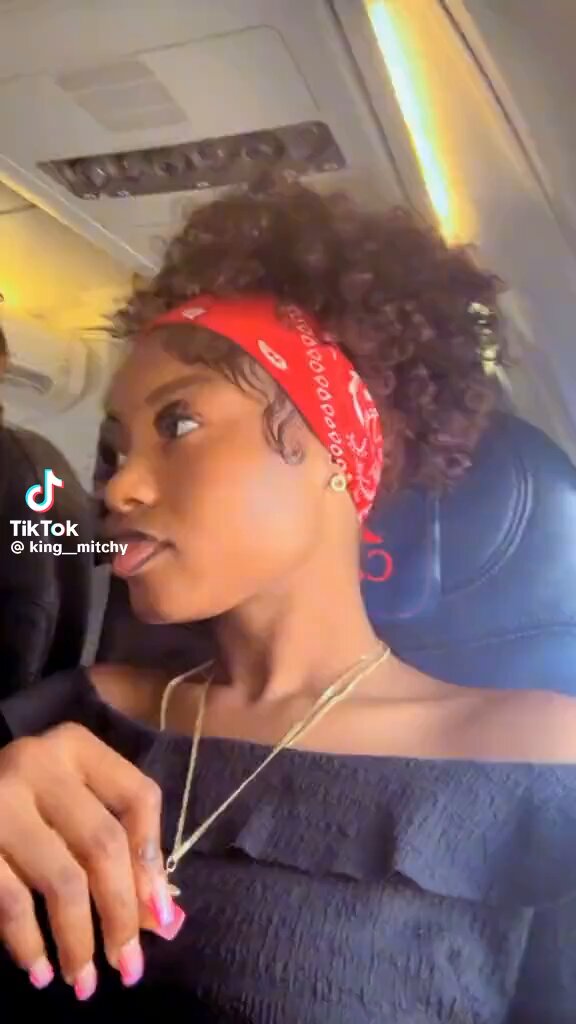 King mitchy mocking a random man napping inside flight