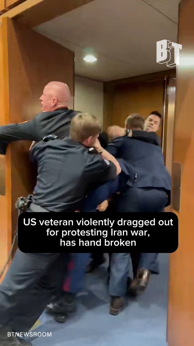 U.S. Marine veteran and anti-war activist Brian McGinnis was forcefully dragged out for disrupting a Senate Armed Services Committee hearing. Senator Tim Sheehy has been accused of breaking McGinnis’s hand after joining Capitol police in the altercation. McGinnis was protesting the war in Iran, shouting as he was ejected, “No one wants to fight for Israel!”