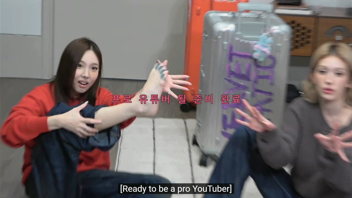 Nayeon's foot using toe separators and Somi helping her hold it to show it off 😭