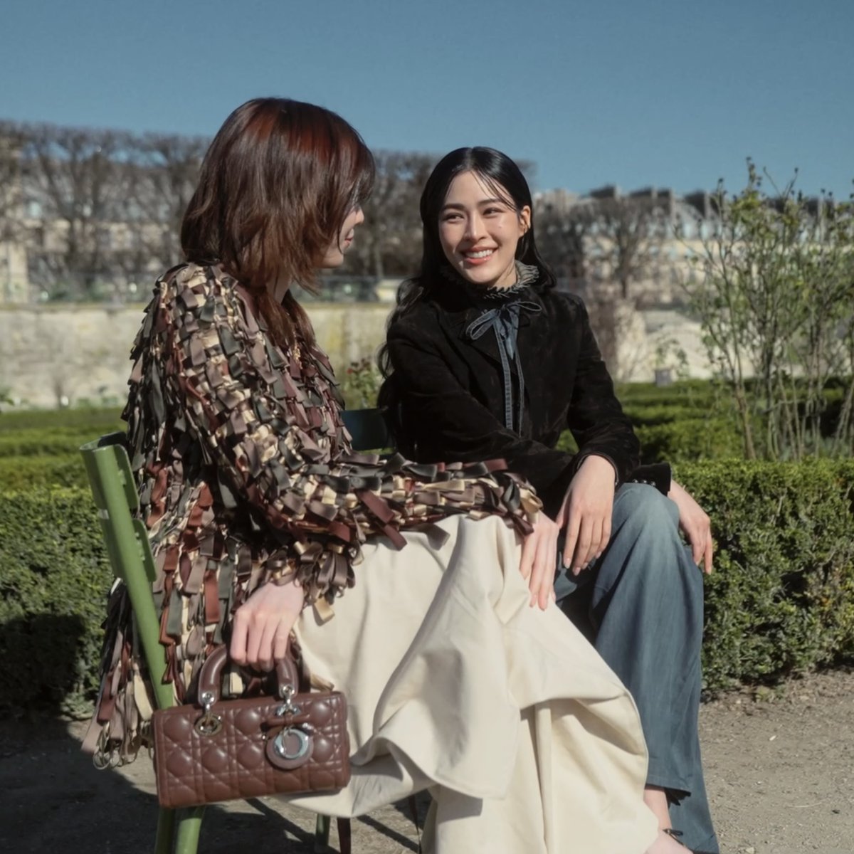 Lingling Kwong and Orm Kornnaphat chatting in the Jardin des Tuileries before the Dior Autumn Winter 2026-2027 show. #DiorAW26