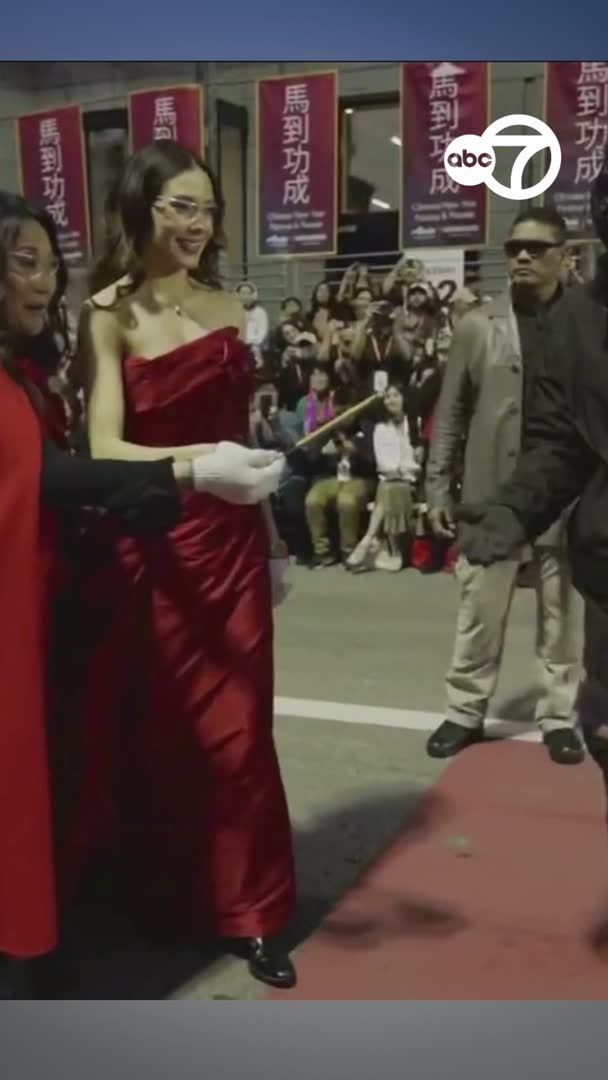 Eileen Gu lights the ceremonial firecrackers as grand marshal of the San Francisco Chinese New Year Parade.