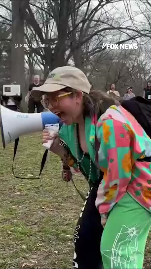 'GET MAD': Woman encourages others to 'scream,' 'bounce,' and 'get mad' during International Women's Day protest in New York City's Central Park.