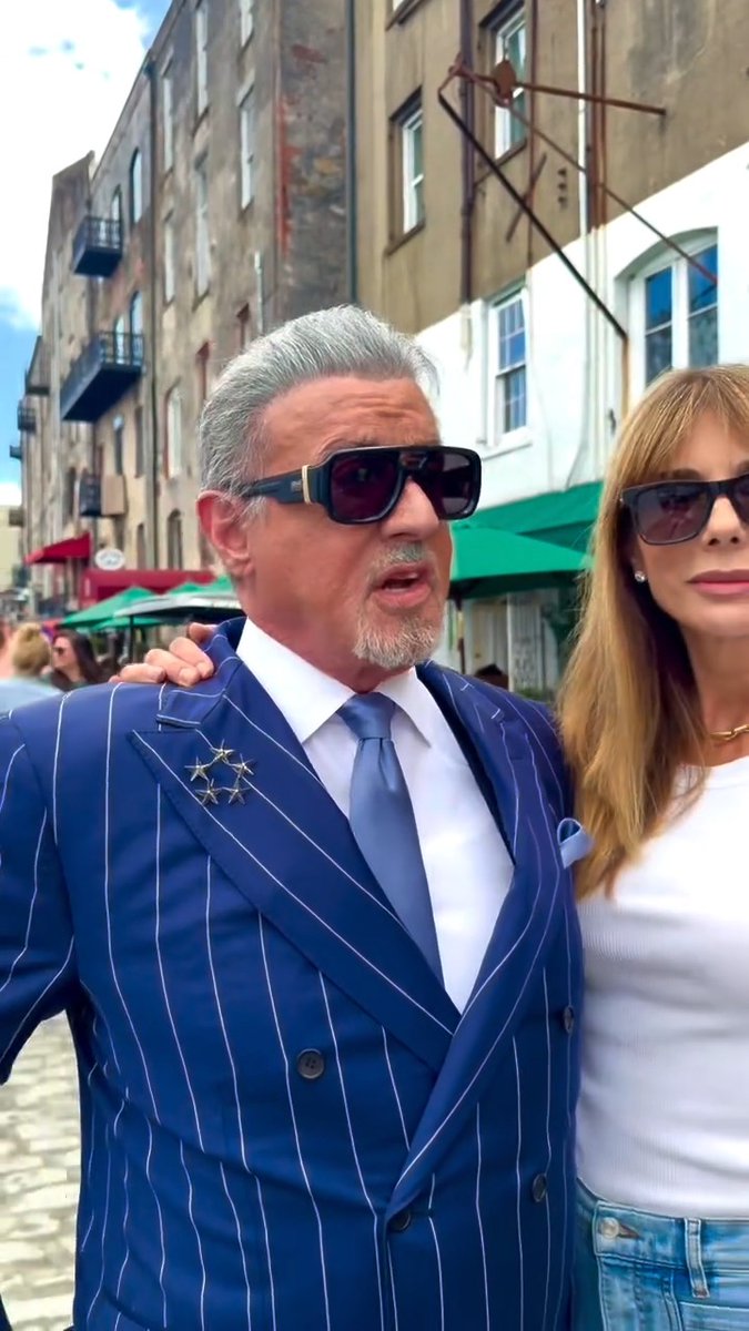 Sylvester Stallone took his wife on a vacation to Italy...in Georgia 😆 The actor and filmmaker, 79, brought his wife Jennifer Flavin, 57, to the set of 'Tulsa King' in Georgia once it had been made over to look like the cobblestone streets of Italy 🇮🇹 "Should we try and find some gelato?" Sylvester asked his wife. 📽️ : #SylvesterStallone #SlyStallone
