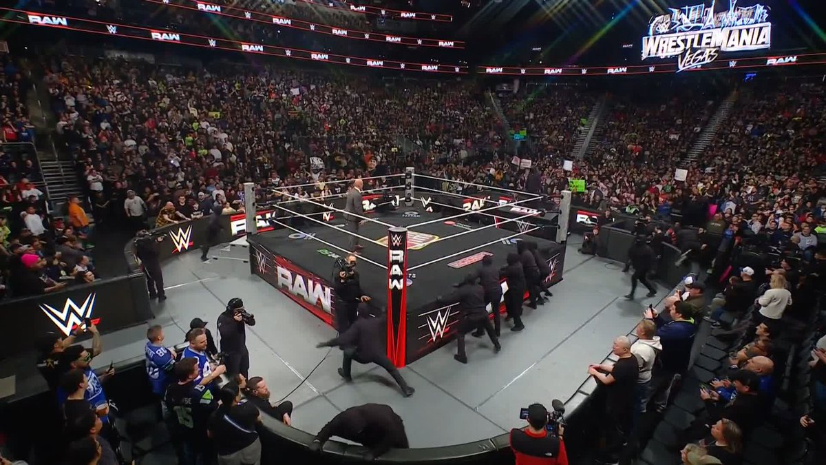 A sea of Masked Men and Seth Rollins IS HERE 🎭 Adam Pearce