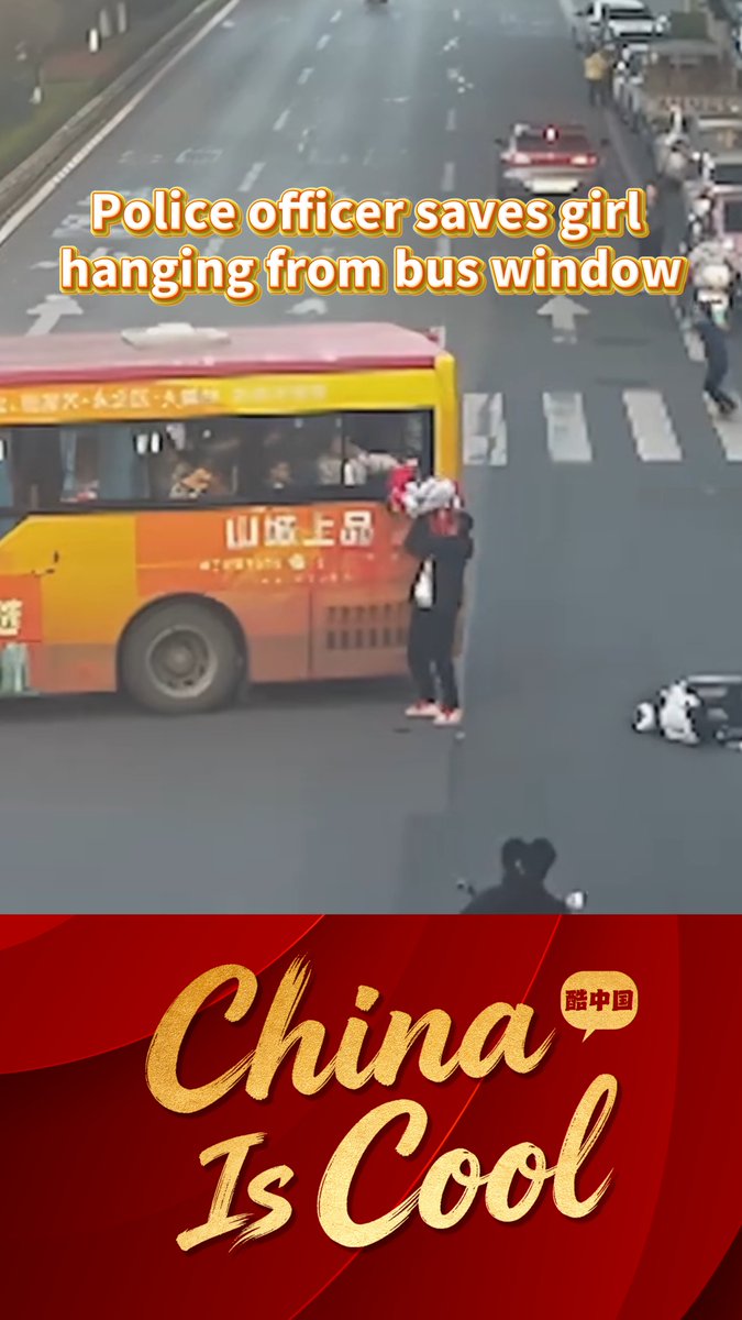 A heart-stopping moment! In Zhangjiajie, central China's Hunan Province, a young girl accidentally slipped out of a bus window and was left hanging in midair. At the critical moment, auxiliary police officer Wu Shengze sped up to catch the bus and lifted the girl, getting her back to safety. #URHero #ChinaStory (Video via People's Daily)